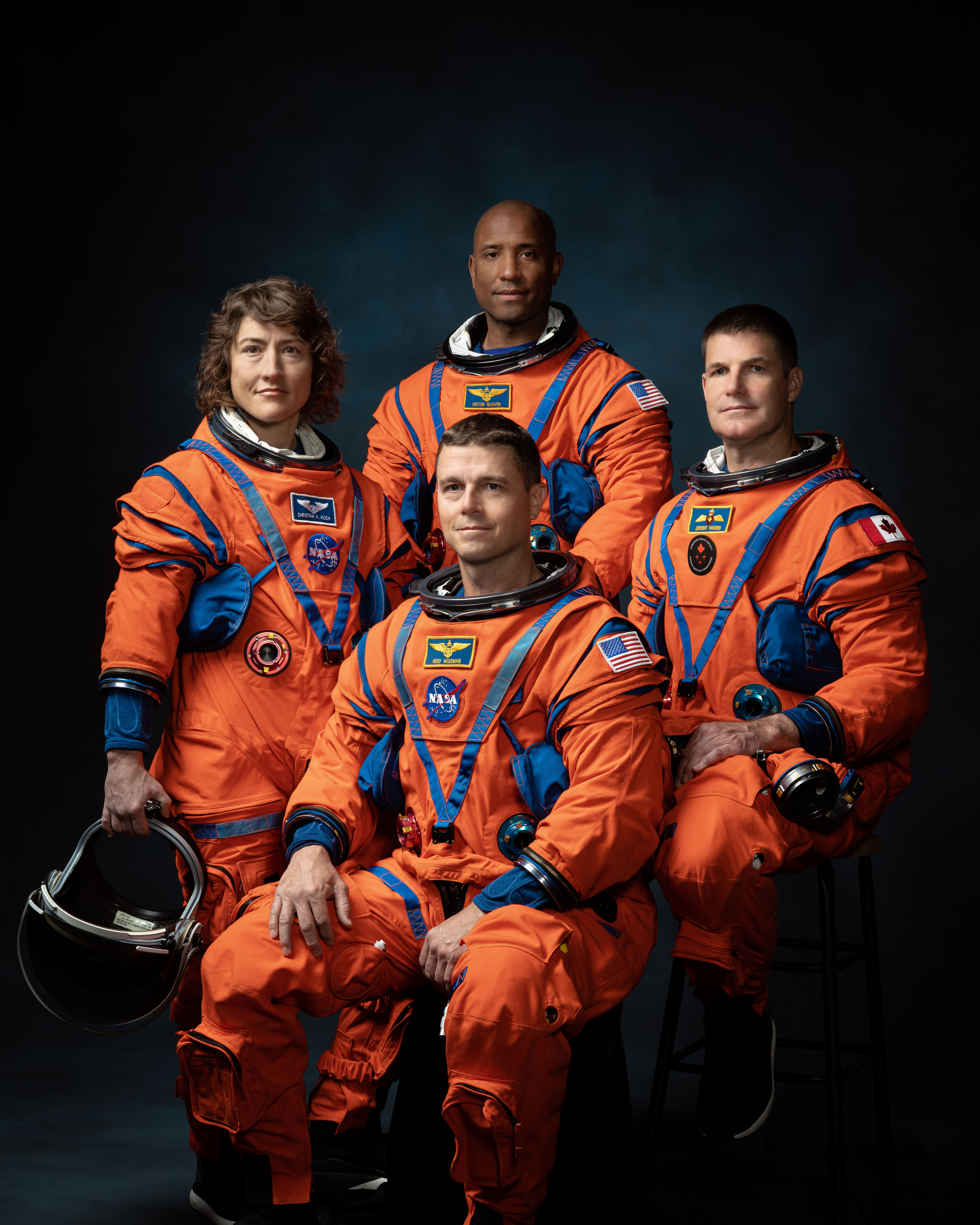 Official NASA Artemis II crew portrait — four astronauts in orange suits