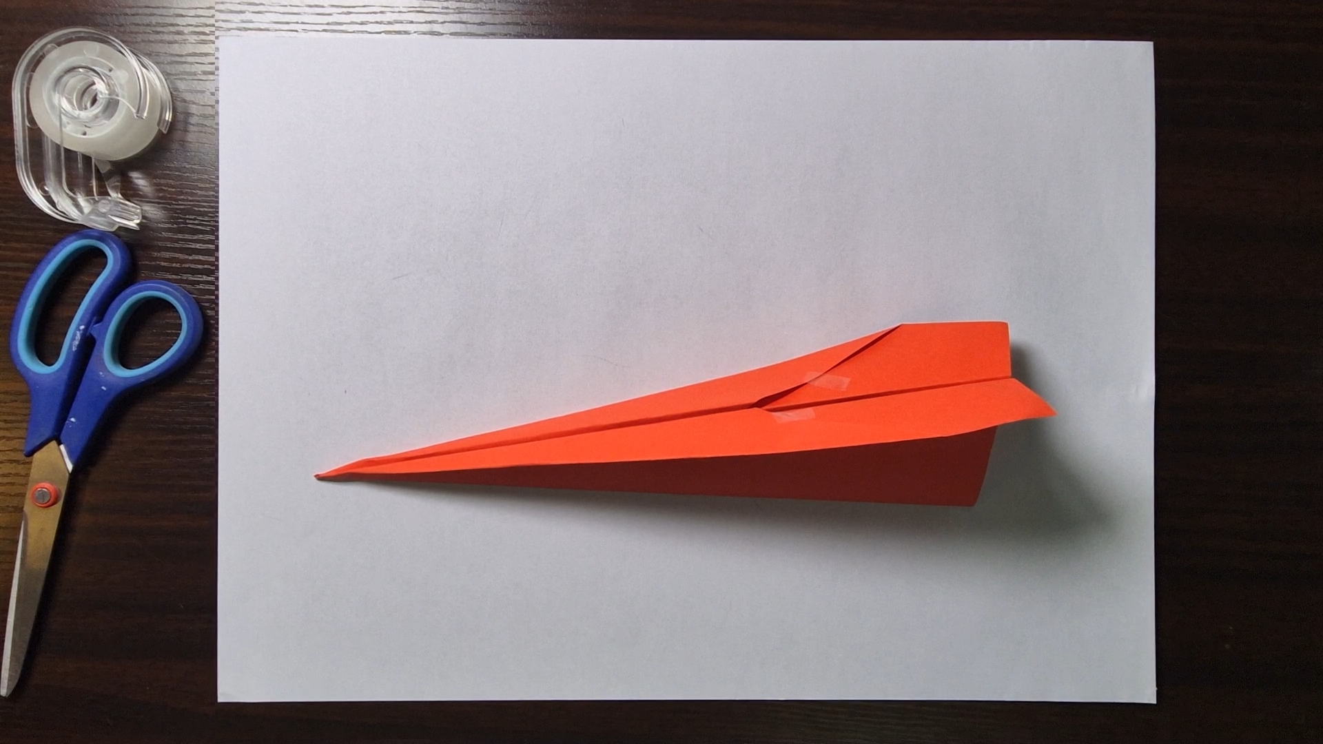 Folded paper airplane, box design with a blunt nose